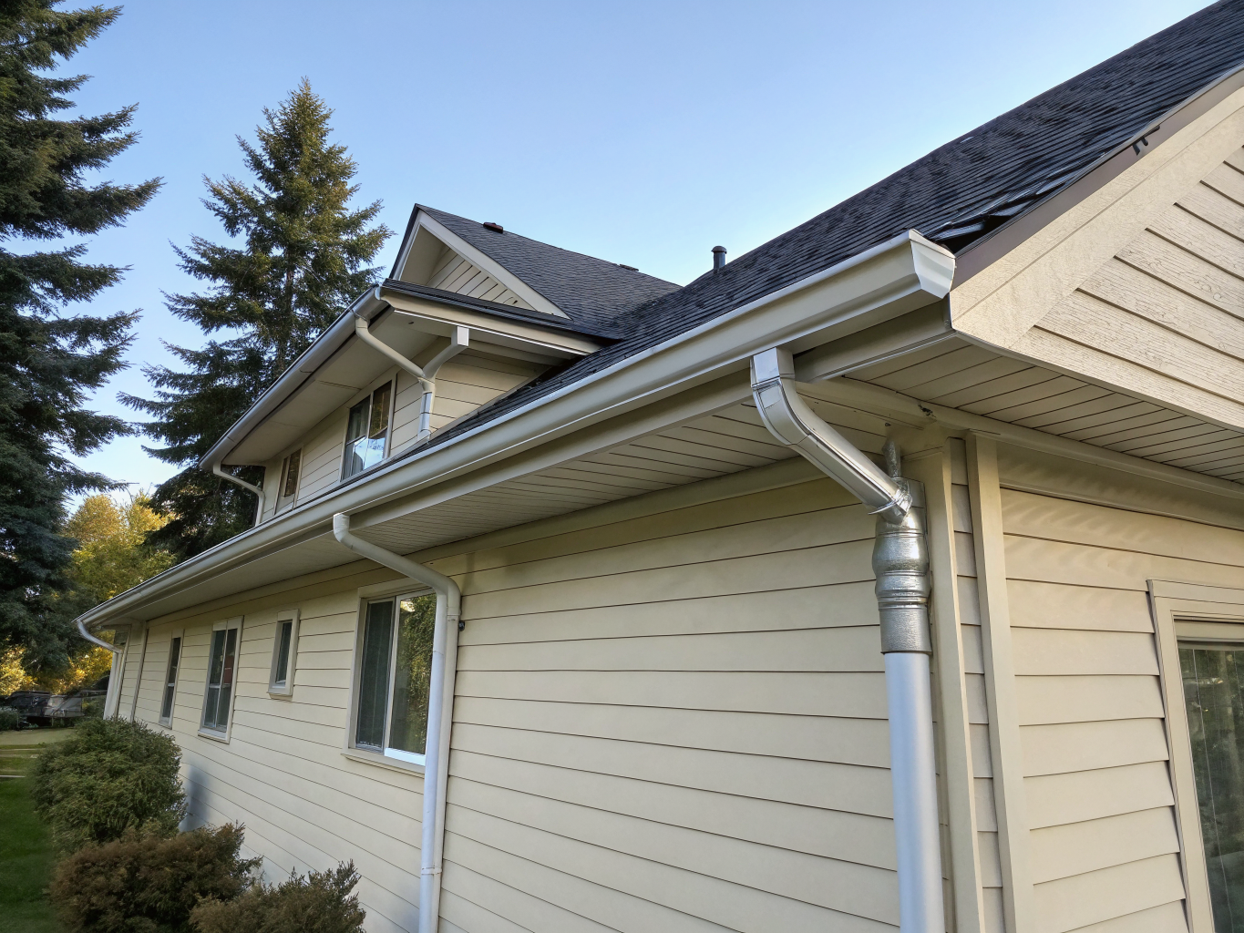 Clean white gutters on a residential home